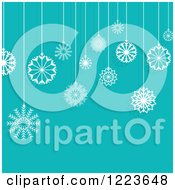 Turquoise Background With Suspended Christmas Snowflake Ornaments
