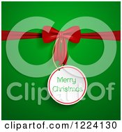 Clipart Of A Merry Christmas Gift Tag And Red Bow Over Green Royalty Free Vector Illustration by KJ Pargeter