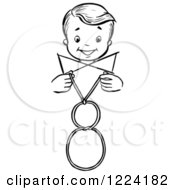 Clipart Of A Black And White Happy Retro Boy Performing A Vanishing Loop Magic Trick Royalty Free Vector Illustration