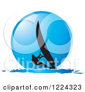 Poster, Art Print Of Silhouetted Windsurfer Over A Blue Circle