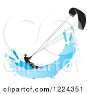 Silhouetted Kite Surfer With A Blue Splash
