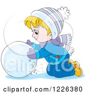 Caucasian Boy Rolling A Ball Of Snow