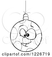 Clipart Of A Black And White Cartoon Dotted Goofy Christmas Bauble Royalty Free Vector Illustration by toonaday