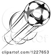 Clipart Of A Black And White Flying Star Soccer Ball Royalty Free Vector Illustration
