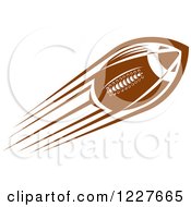 Clipart Of A Flying American Football Royalty Free Vector Illustration by Vector Tradition SM