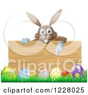 Poster, Art Print Of Brown Bunny Over A Wood Sign And Easter Eggs