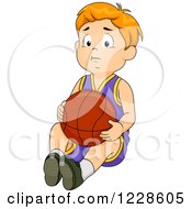 Sad Caucasian Boy Sitting With A Basketball