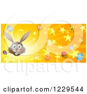 Clipart Of A Brown Bunny Face With Easter Stars And Eggs Bursting Royalty Free Vector Illustration