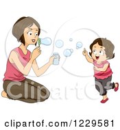 Mom And Daughter Blowing Bubbles