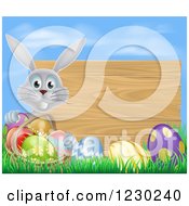 Poster, Art Print Of Gray Rabbit With A Basket And Easter Eggs By A Wooden Sign Under A Blue Sky