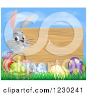 Poster, Art Print Of Gray Bunny Rabbit With A Basket And Easter Eggs By A Wooden Sign Under A Blue Sky