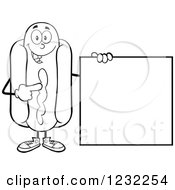 Clipart Of A Black And White Hot Dog Mascot Pointing To A Sign Royalty Free Vector Illustration