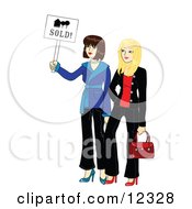 Two Young Beautiful Real Estate Agent Realtors Holding A Sold Sign