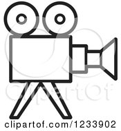 Clipart Of A Black And White Movie Camera Royalty Free Vector Illustration by Lal Perera