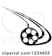 Clipart Of A Black And White Flying Soccer Ball 10 Royalty Free Vector Illustration