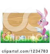 Poster, Art Print Of Pink Bunny Pointing To A Wood Sign With Grass And Easter Eggs
