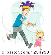 Young Father Wearing A Fools Hat And Chasing A Blond Toddler Girl