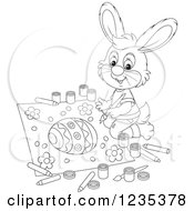 Clipart Of A Black And White Male Bunny Painting A Picture Of An Easter Egg Royalty Free Vector Illustration