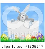 Poster, Art Print Of Gray Bunny Rabbit Pointing Down To A Sign With Grass And Easter Eggs