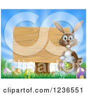 Poster, Art Print Of Brown Bunny By A Posted Wood Sign With A Basket Grass And Easter Eggs
