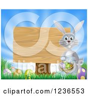 Poster, Art Print Of Gray Bunny By A Posted Wood Sign With A Basket Grass And Easter Eggs