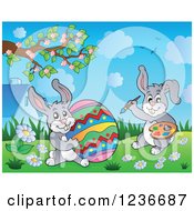 Clipart Of Gray Easter Bunny Rabbits Painting A Giant Egg Royalty Free Vector Illustration