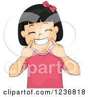 Poster, Art Print Of Happy Asian Girl Holding Up Corners Of Her Mouth And Grinning