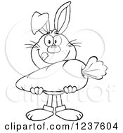 Clipart Of A Black And White Rabbit Holding A Giant Carrot Royalty Free Vector Illustration