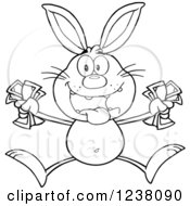 Clipart Of A Black And White Rabbit Jumping With Cash Money Royalty Free Vector Illustration