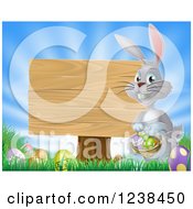 Poster, Art Print Of Gray Bunny By A Wood Sign With A Basket Grass And Easter Eggs