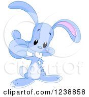 Clipart Of A Happy Purple Bunny Rabbit Holding A Thumb Up Royalty Free Vector Illustration