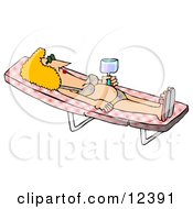 Relaxed Woman In A Bikini Sun Bathing On A Lounge Chair