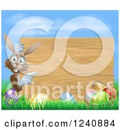 Poster, Art Print Of Wood Sign With A Brown Easter Bunny Eggs Grass And Sky