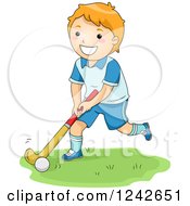 Happy Red Haired Boy Playing Field Hockey