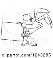 Clipart Of A Black And White Cartoon Easter Bunny Rabbit Holding A Blank Sign Royalty Free Vector Illustration