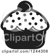 Clipart Of A Black And White Polka Dot Cupcake Royalty Free Vector Illustration by Lal Perera