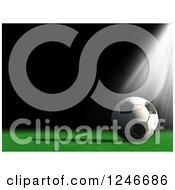 Clipart Of A 3d Light Shining Down On A Soccer Ball Royalty Free Illustration