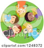 Happy Diverse Children With Educational Supplies Laying In Grass