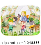 Female Teacher And Children Exploring A Greenhouse Garden
