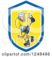 Poster, Art Print Of Cartoon Male Hockey Player In Blue And Yellow In A Shield