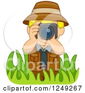 Blond Safari Boy Taking Pictures In Grasses