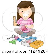 Happy Brunette Girl Sitting On The Floor And Sewing
