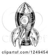 Clipart Of A Black And White Woodcut Rocket Royalty Free Vector Illustration