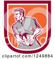 Clipart Of A Retro Rugby Player In A Red And Orange Shield Royalty Free Vector Illustration