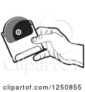 Poster, Art Print Of Black And White Hand Holding A Dvd Or Cd In A Sleeve