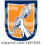 Clipart Of A Retro Woodcut Hand Holding Up A Spanner Wrench In A Blue White And Orange Shield Royalty Free Vector Illustration
