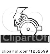 Black And White Hand Operating A Circular Saw