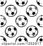 Clipart Of A Seamless Background Pattern Of Black And White Soccer Balls Royalty Free Vector Illustration