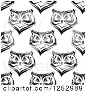 Clipart Of A Seamless Background Pattern Of Black And White Owl Faces Royalty Free Vector Illustration
