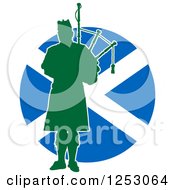 Green Silhouetted Scot Piper Holding Bagpipes Over A Scottish Flag